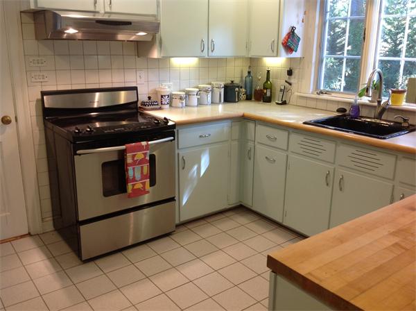 30 Ginn Road Winchester, MA 01890 - Photo 11 of 26 a kitchen with a stove sink and cabinets