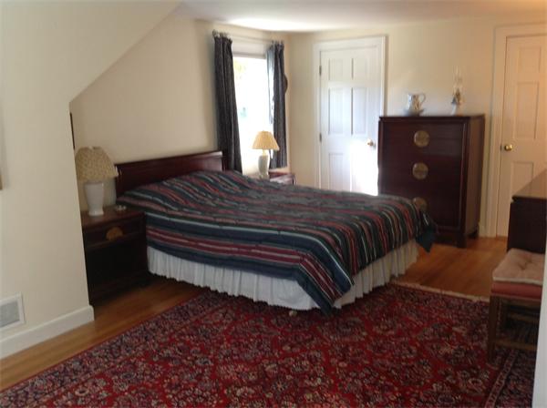 30 Ginn Road Winchester, MA 01890 - Photo 15 of 26 a bedroom with a bed and wooden floor