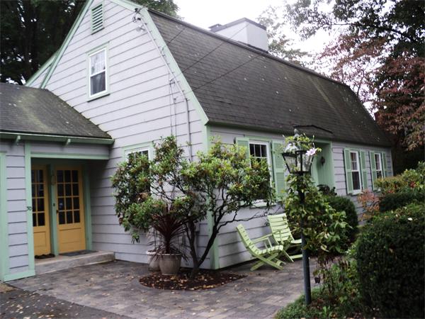 30 Ginn Road Winchester, MA 01890 - Photo 4 of 26 a view of a white house with a potted plant and a large tree