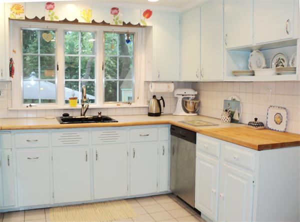 30 Ginn Road Winchester, MA 01890 - Photo 10 of 26 a kitchen with stainless steel appliances granite countertop a sink and a white cabinets