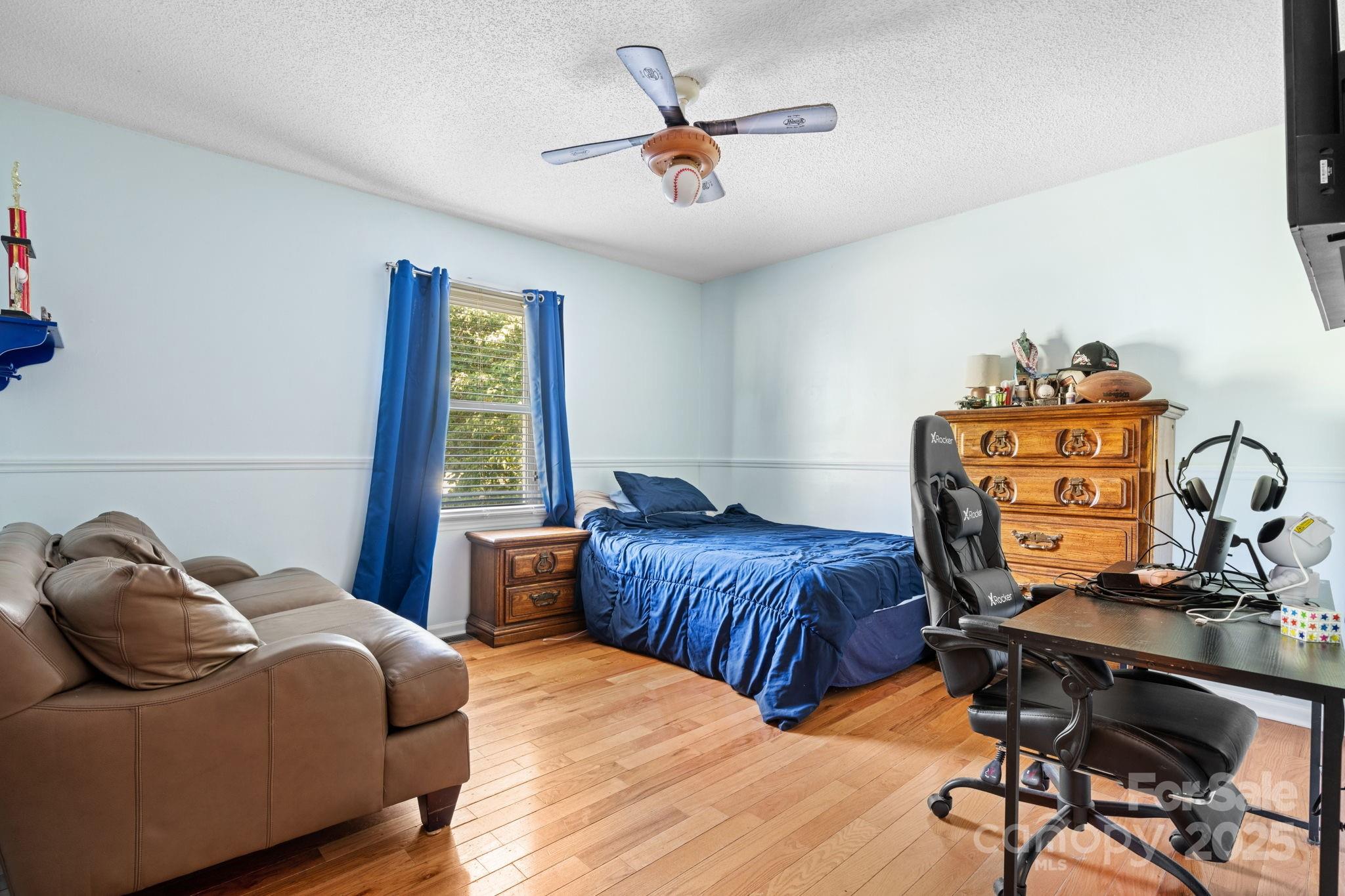 3399 Harvard Place Hudson, NC 28638 - Photo 15 of 30 a bedroom with two beds and a chandelier