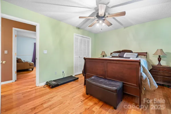 a living room with a bed and furniture