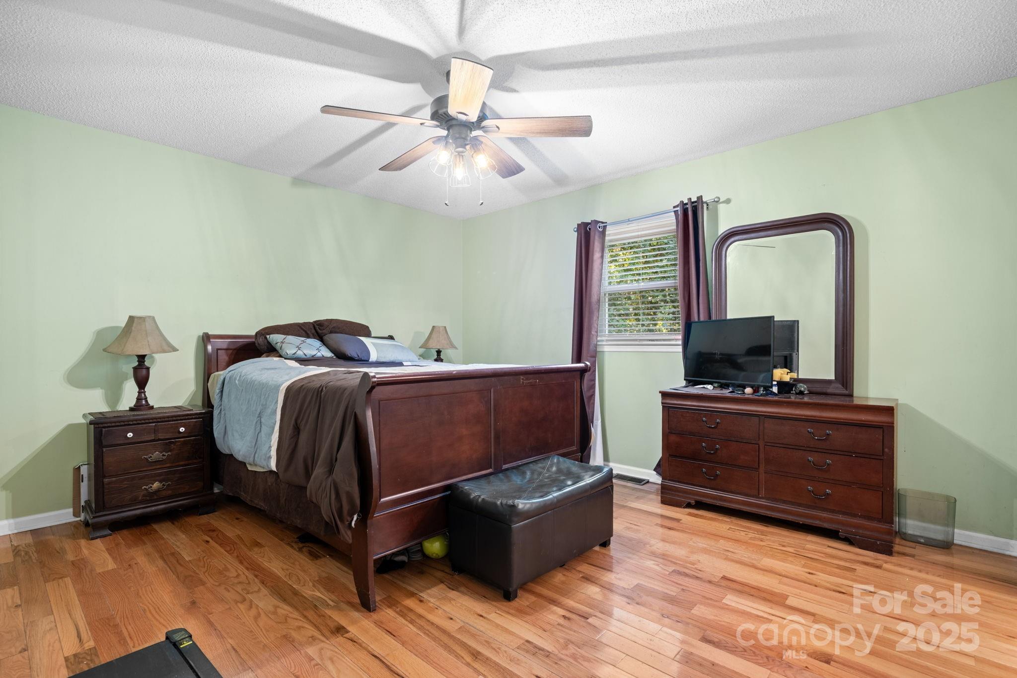 3399 Harvard Place Hudson, NC 28638 - Photo 19 of 30 a bedroom with a bed and window