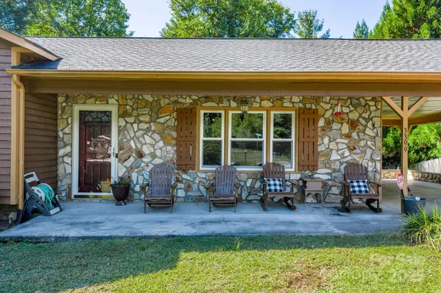a front view of a house with outdoor seating
