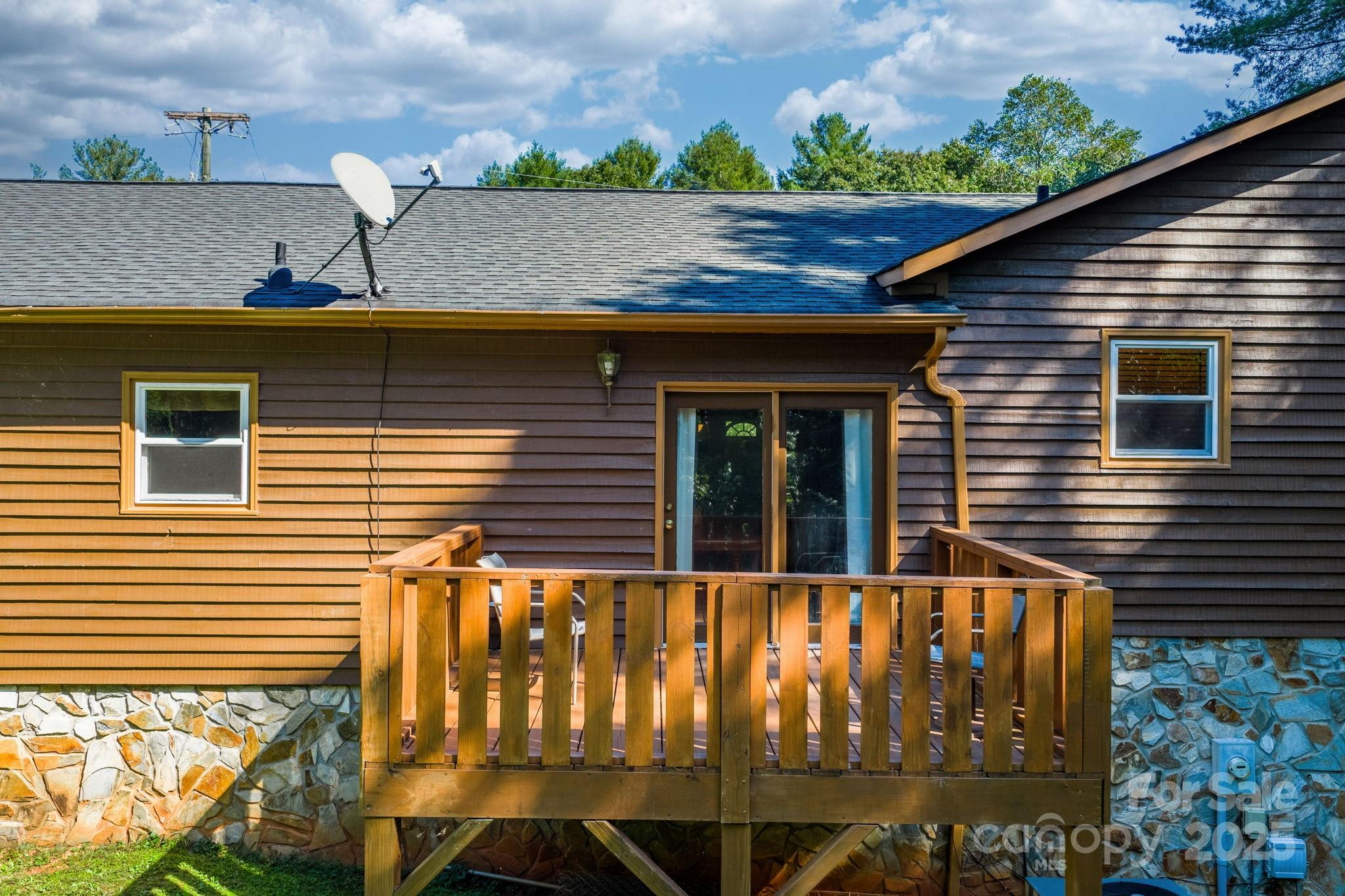 3399 Harvard Place Hudson, NC 28638 - Photo 25 of 30 a view of house with backyard and glass windows