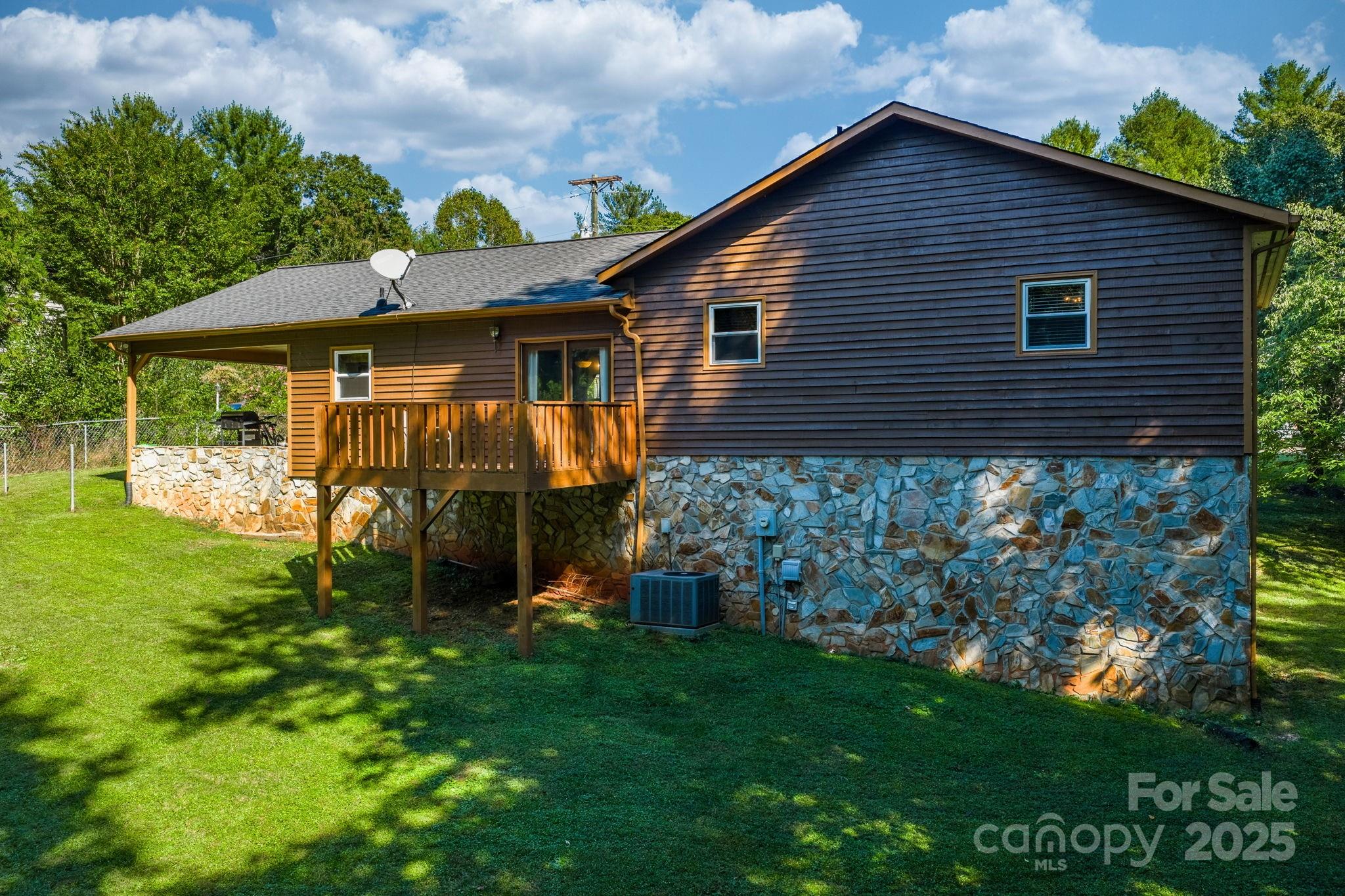 3399 Harvard Place Hudson, NC 28638 - Photo 26 of 30 a view of a house with a yard