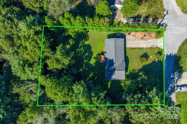 an aerial view of a house with a garden