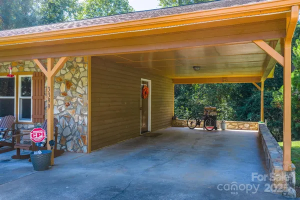 a view of a room with wooden floor and outdoor space