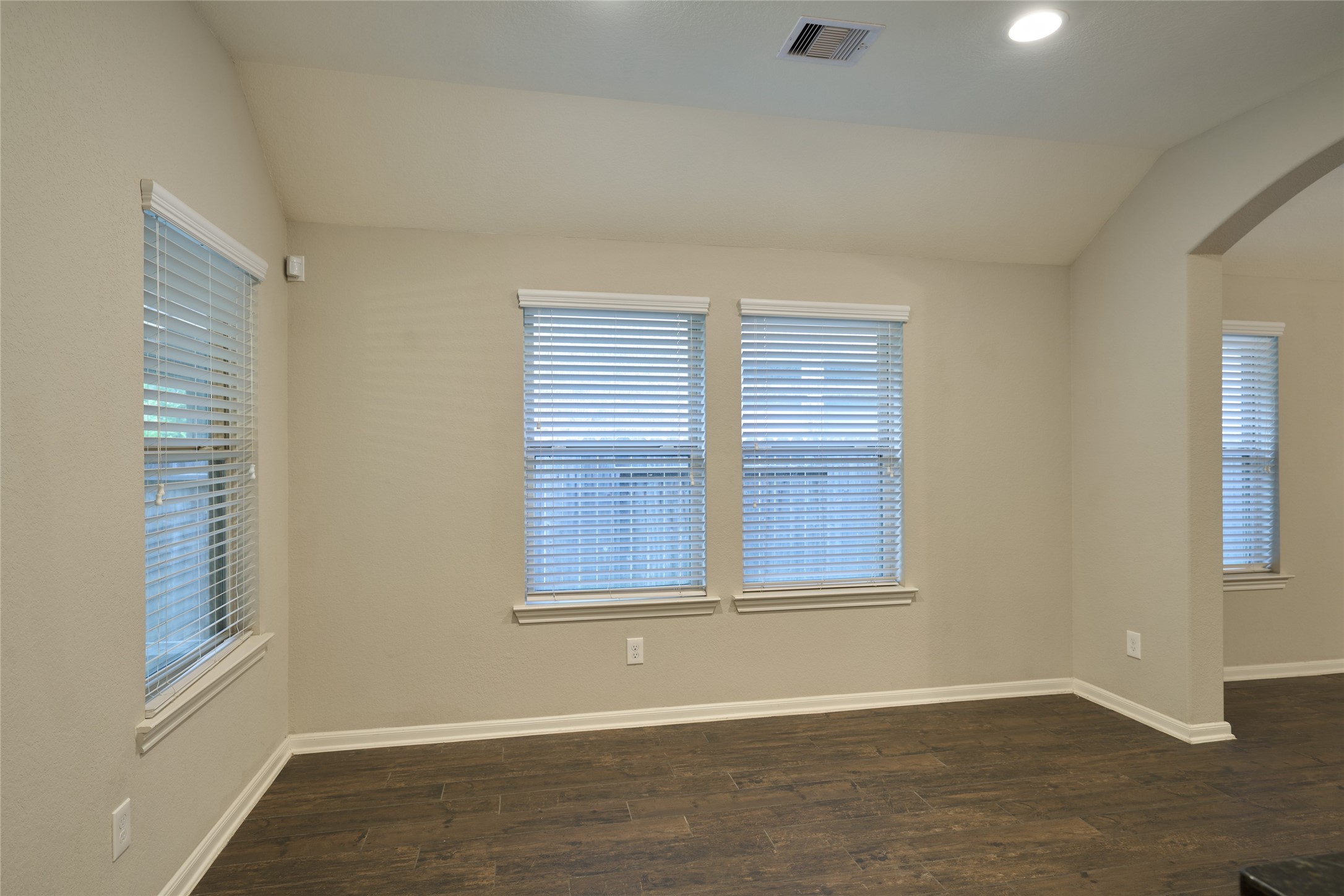 116 Fox Trail Road Montgomery, TX 77316 - Photo 23 of 50 The dining area features neutral walls, dark tile flooring, and multiple windows with views of the backyard.