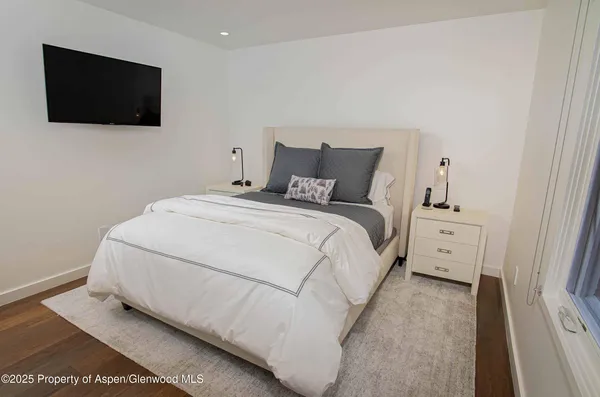 a large white bed in a white room