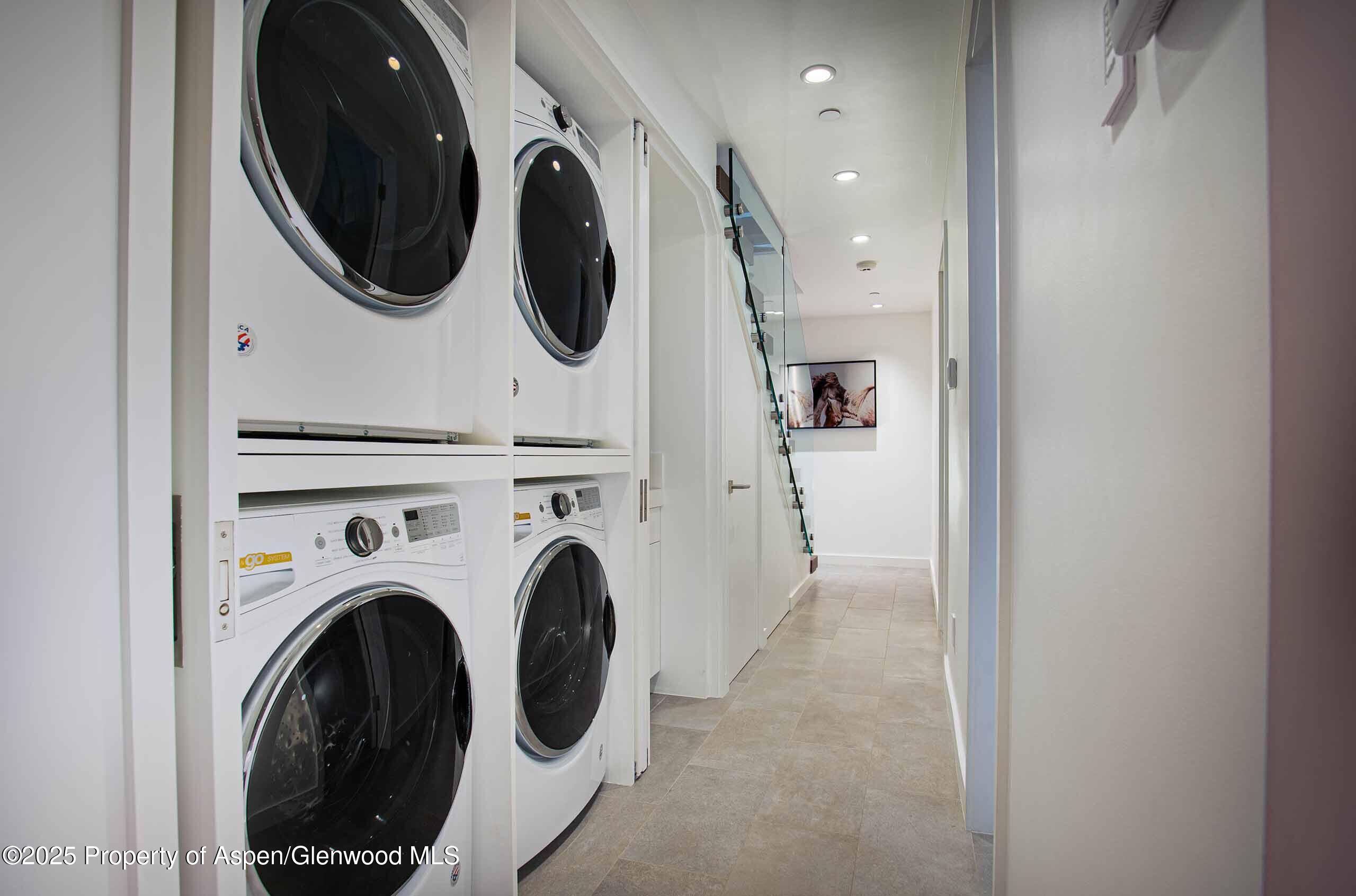 1018 East Hyman Avenue, Unit 1 Aspen, CO 81611 - Photo 24 of 28 a view of a hallway with washer and dryer