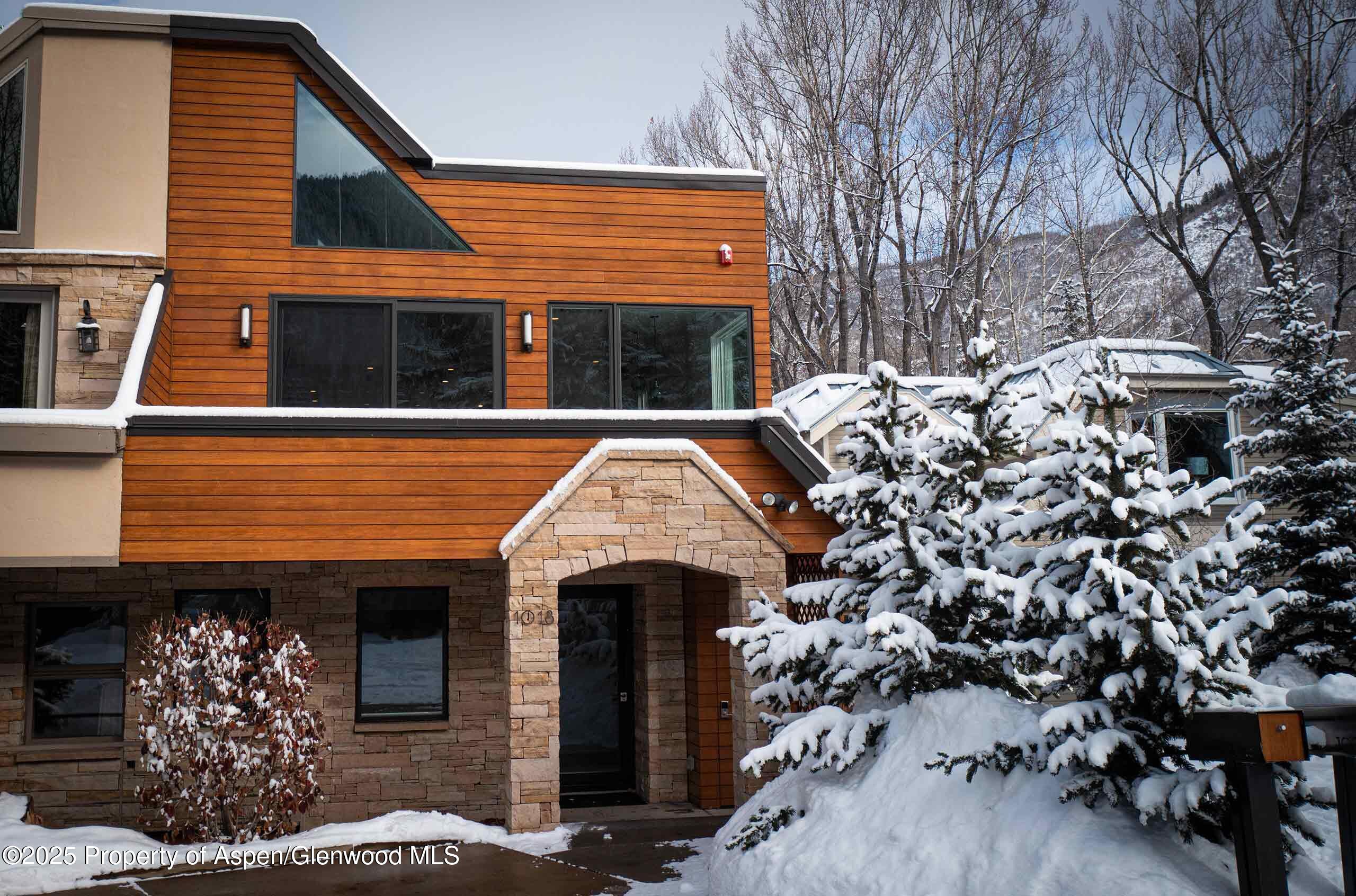 1018 East Hyman Avenue, Unit 1 Aspen, CO 81611 - Photo 27 of 28 a view of a house with a balcony