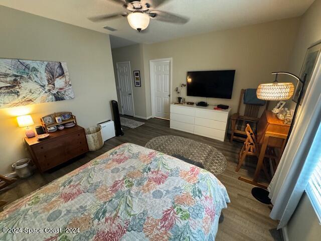 2780 Reston Street, Unit 106 Melbourne, FL 32935 - Photo 17 of 24 a bedroom with a bed and a flat screen tv