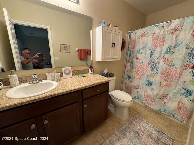 2780 Reston Street, Unit 106 Melbourne, FL 32935 - Photo 22 of 24 a bathroom with a double vanity sink toilet and a mirror