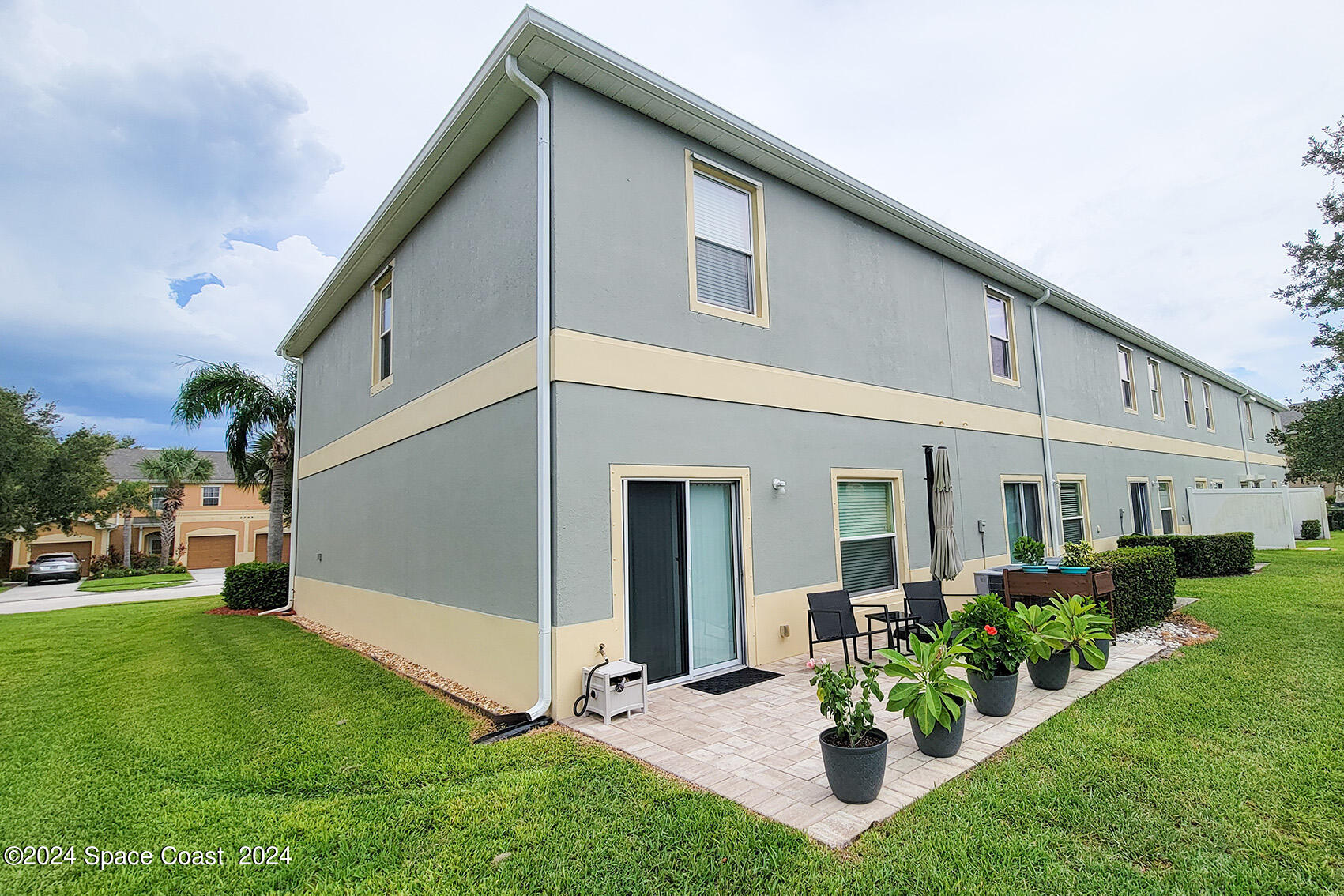 2780 Reston Street, Unit 106 Melbourne, FL 32935 - Photo 3 of 24 a view of a house with backyard and sitting area