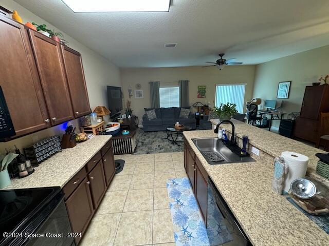 2780 Reston Street, Unit 106 Melbourne, FL 32935 - Photo 10 of 24 a kitchen with sink refrigerator and window
