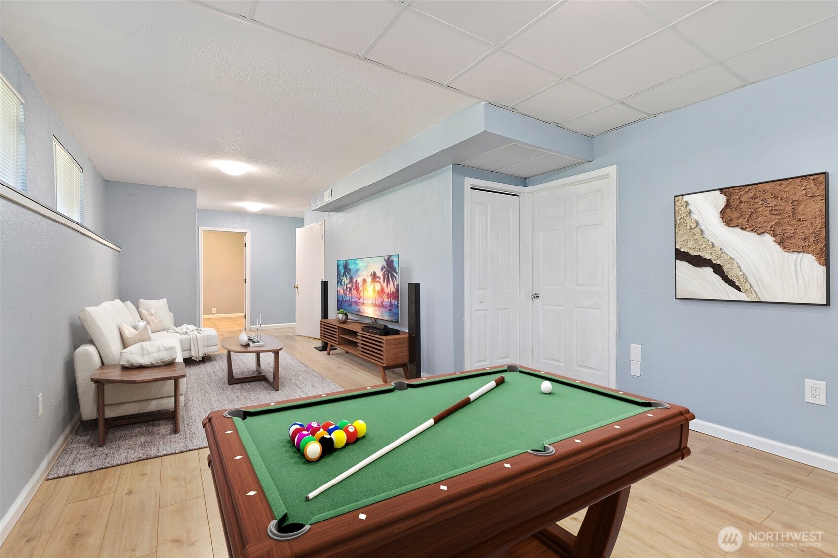 9880 Fredrickson Road Northwest Bremerton, WA 98311 - Photo 19 of 28 a room with furniture and a flat screen tv