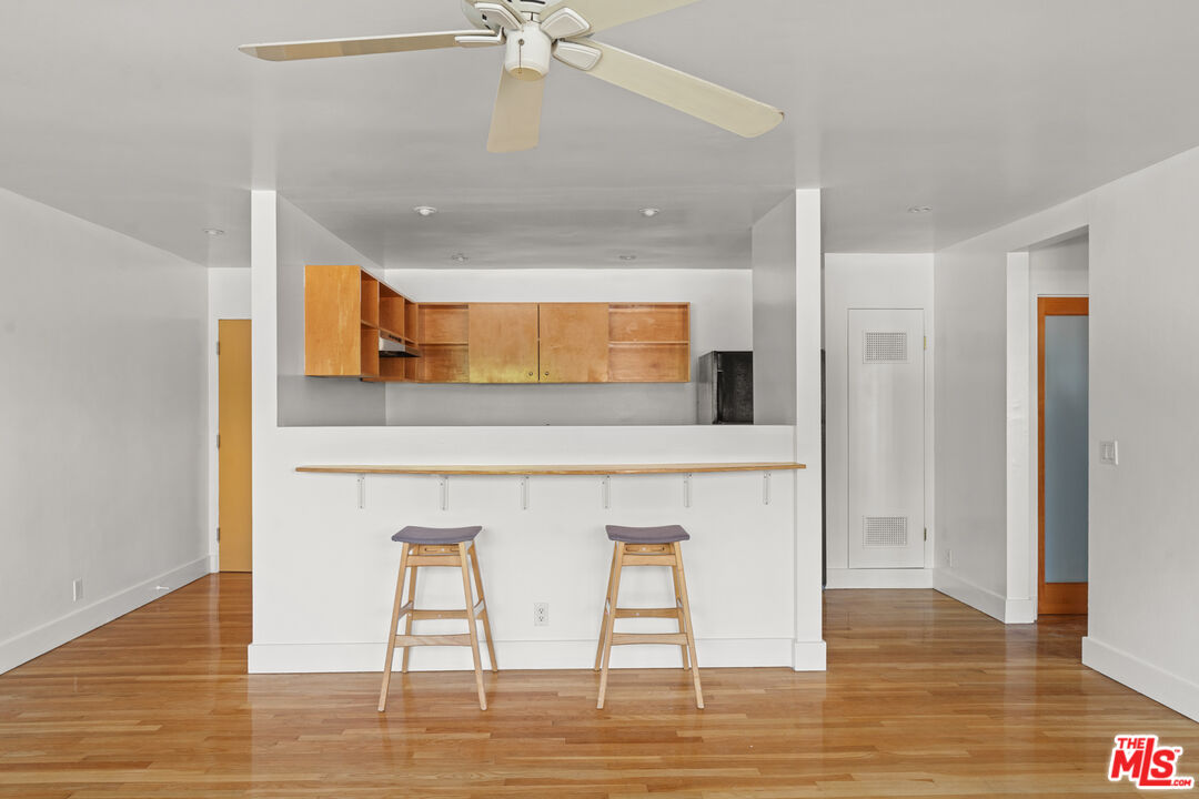 511 Rialto Avenue, Unit 4 Venice, CA 90291 - Photo 3 of 17 a kitchen with stainless steel appliances kitchen island a chandelier