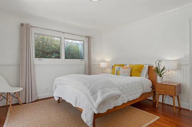 a bedroom with a bed and window