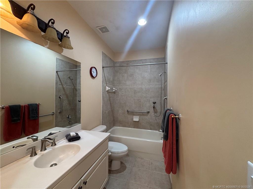 262 Southwest Walking Path, Unit 262 Stuart, FL 34997 - Photo 36 of 39 a bathroom with a sink a toilet and shower