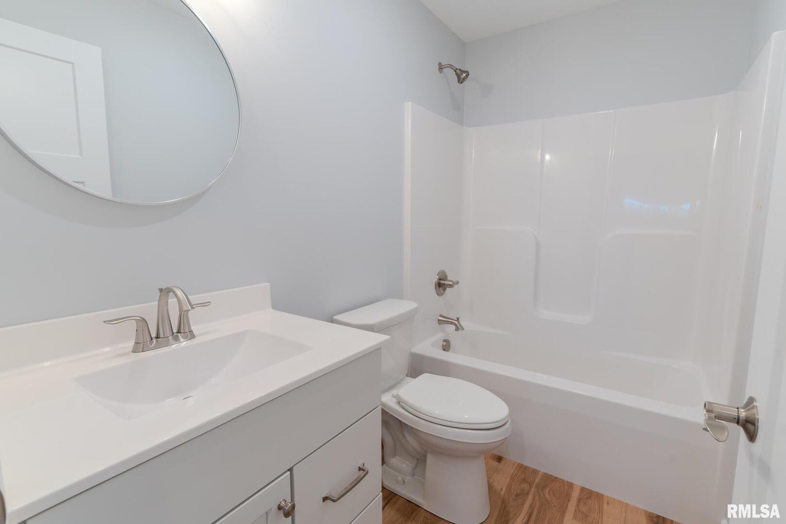 941 9th Avenue North Clinton, IA 52732 - Photo 19 of 24 a bathroom with a sink a toilet and shower