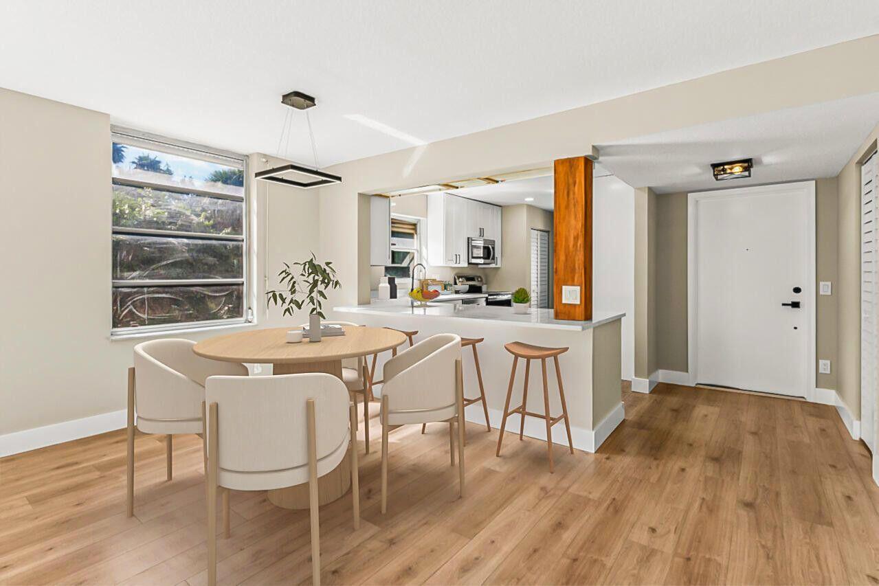 1 Harbourside Drive, Unit 1301 Delray Beach, FL 33483 - Photo 4 of 13 a dining room with furniture and wooden floor