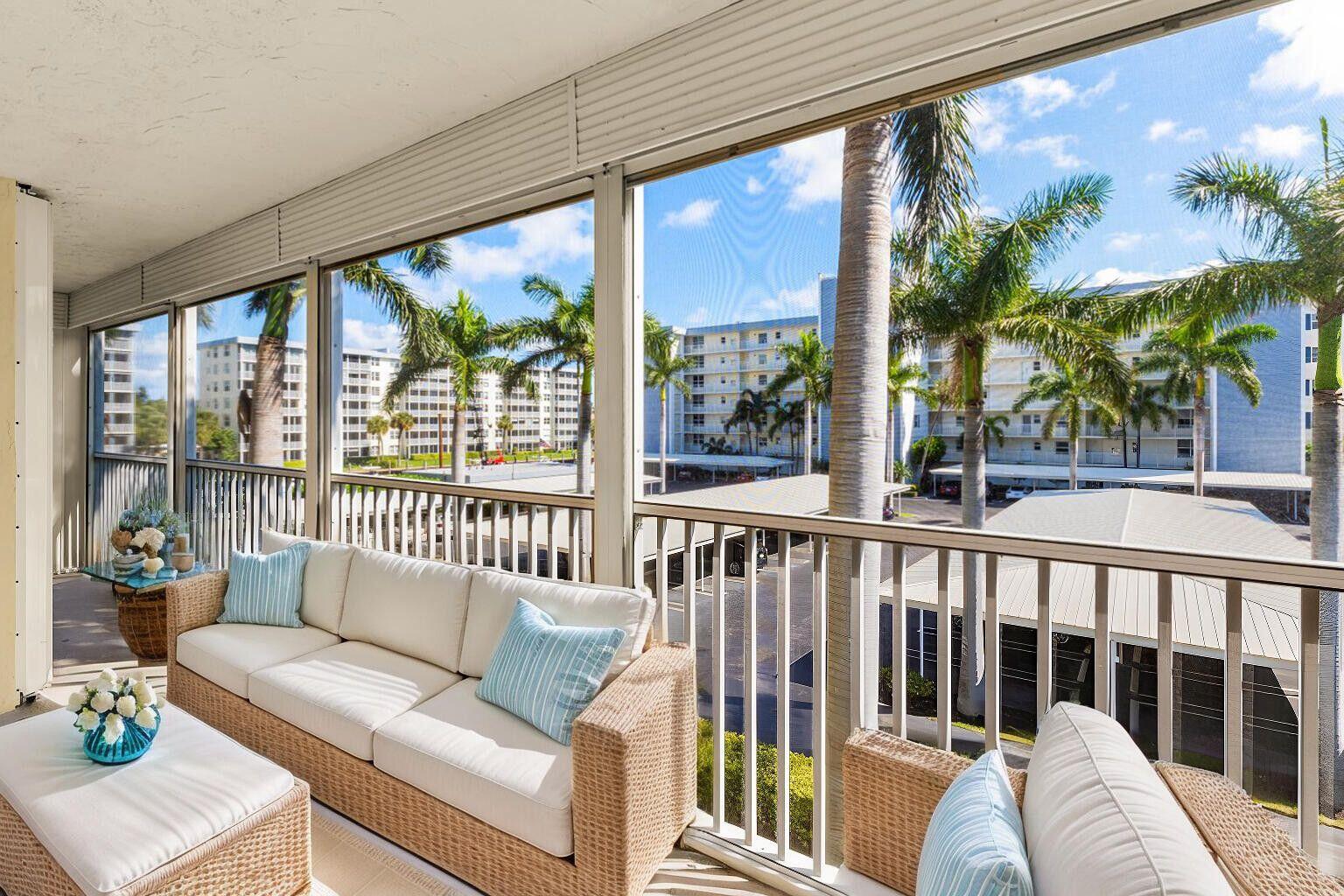 1 Harbourside Drive, Unit 1301 Delray Beach, FL 33483 - Photo 5 of 13 a living room with furniture and a large window