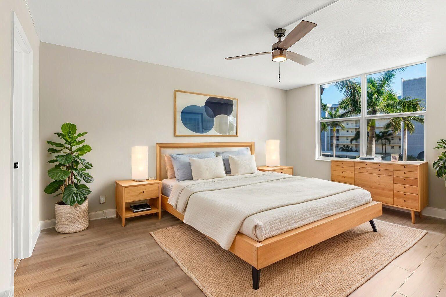 1 Harbourside Drive, Unit 1301 Delray Beach, FL 33483 - Photo 6 of 13 a bedroom with a bed and a potted plant