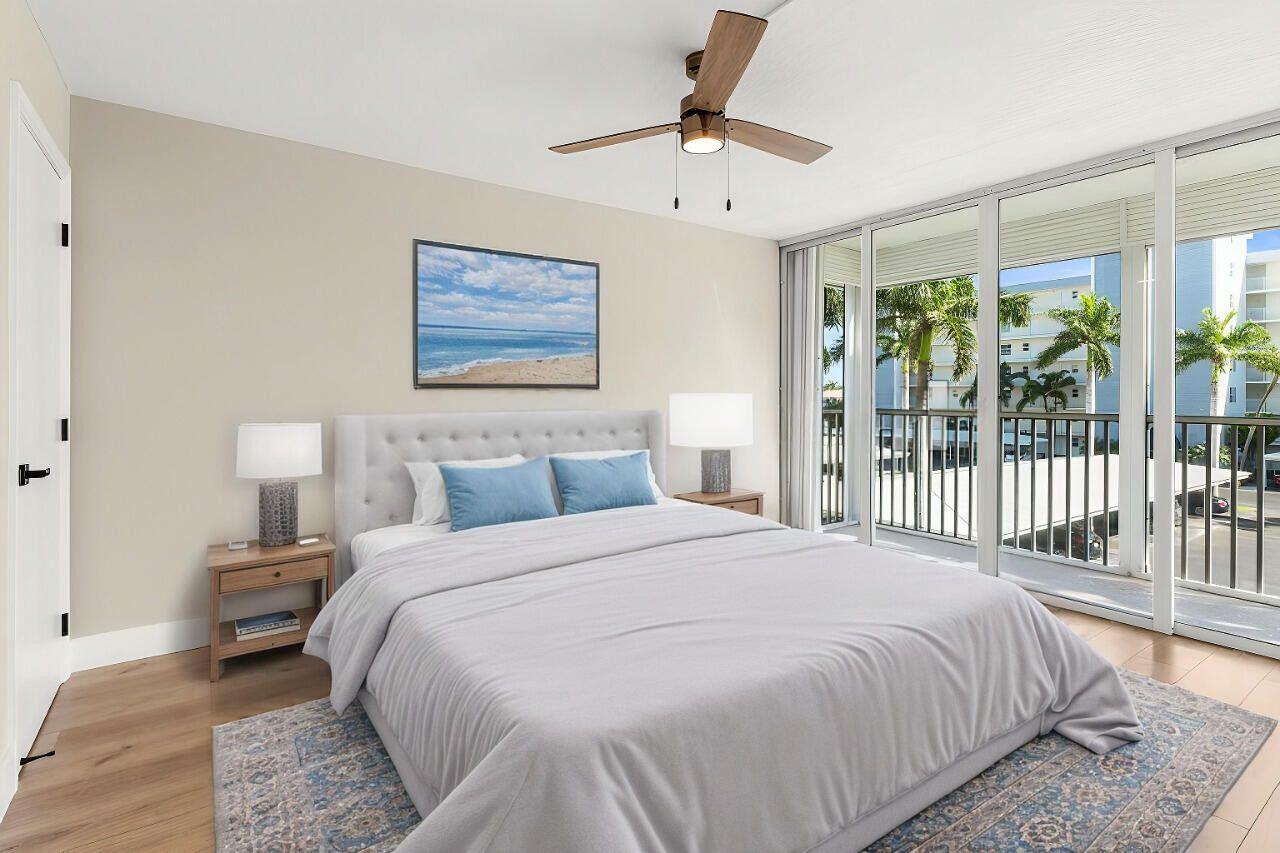 1 Harbourside Drive, Unit 1301 Delray Beach, FL 33483 - Photo 9 of 13 a bedroom with a large bed and a window