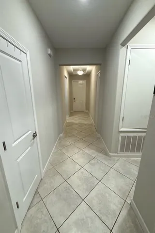 a bedroom with a bed and gym equipment