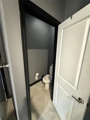 a bathroom with a sink a large mirror and a shower