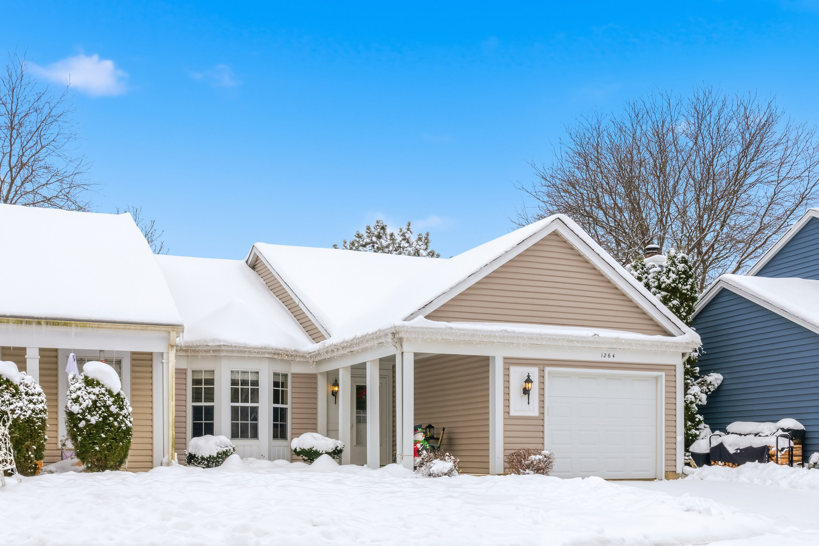 1264 Huntington Drive Mundelein, IL 60060 - Photo 2 of 32 a view of a white house with a outdoor space