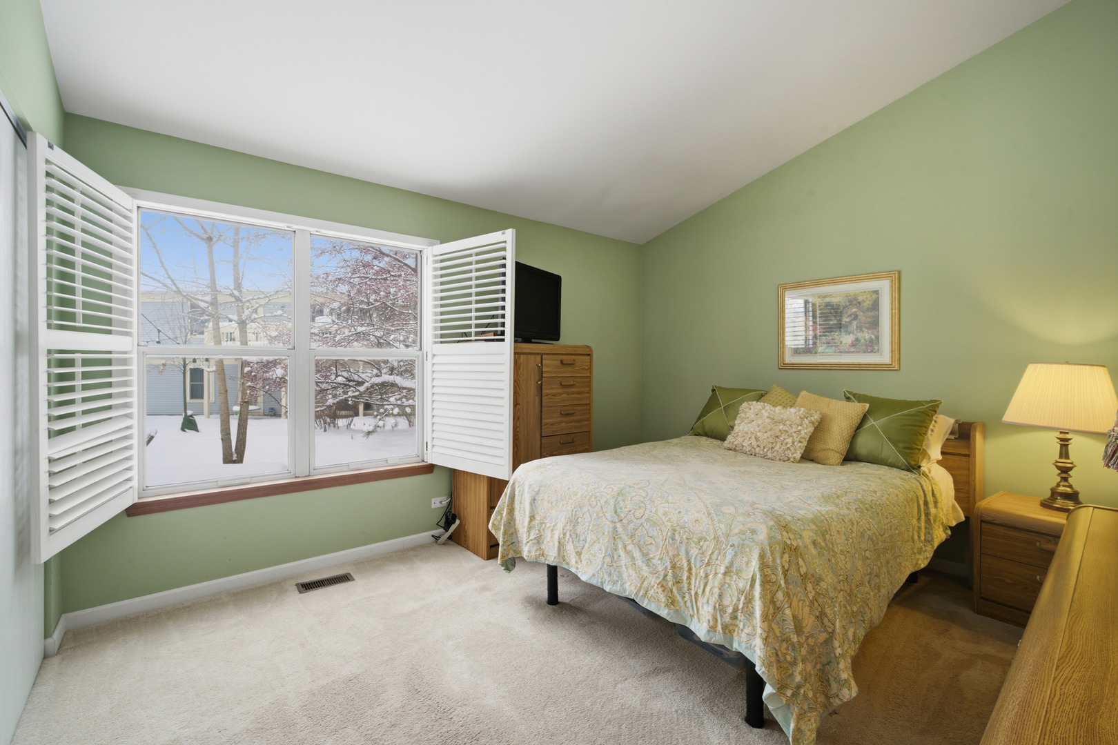 1264 Huntington Drive Mundelein, IL 60060 - Photo 21 of 32 a bedroom with a bed painting and a large window