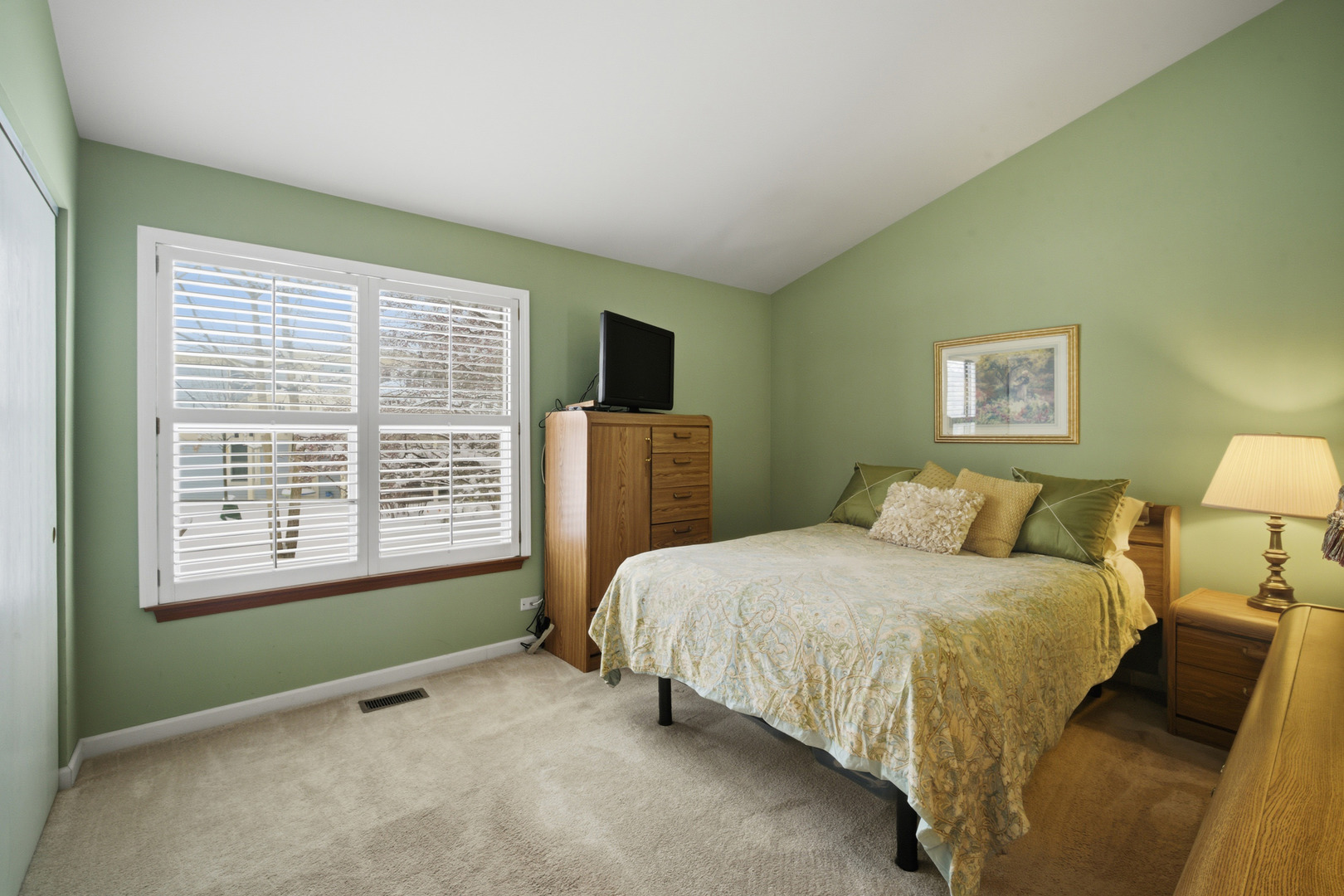 1264 Huntington Drive Mundelein, IL 60060 - Photo 22 of 32 a bedroom with a bed and a window