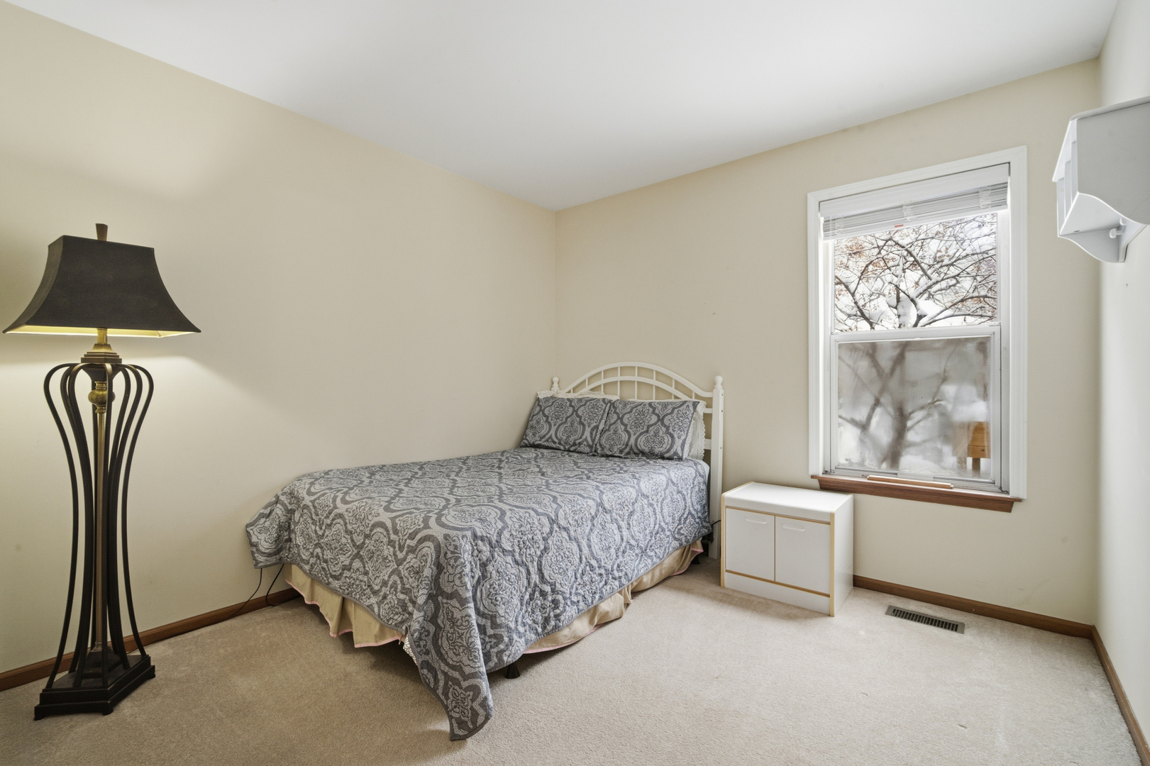 1264 Huntington Drive Mundelein, IL 60060 - Photo 24 of 32 a spacious bedroom with a bed and window