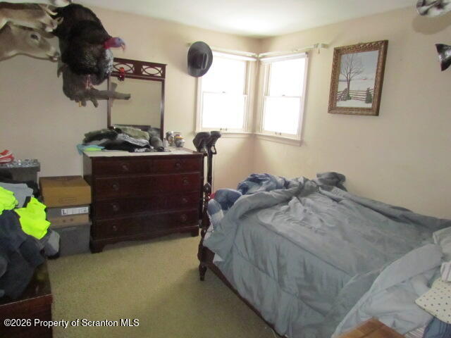 691 Madisonville Road Moscow, PA 18444 - Photo 11 of 33 a bed room with a bed and a dresser