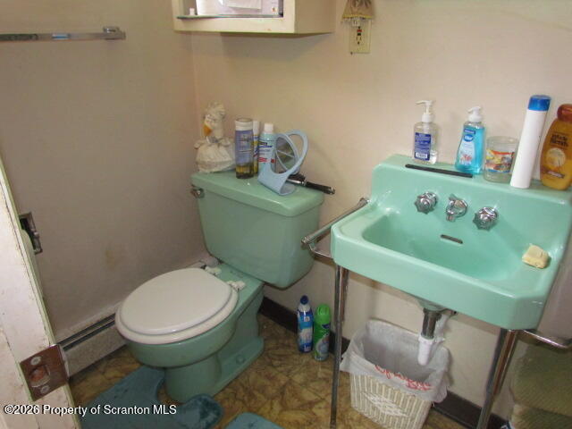691 Madisonville Road Moscow, PA 18444 - Photo 19 of 33 a bathroom with a toilet and a sink