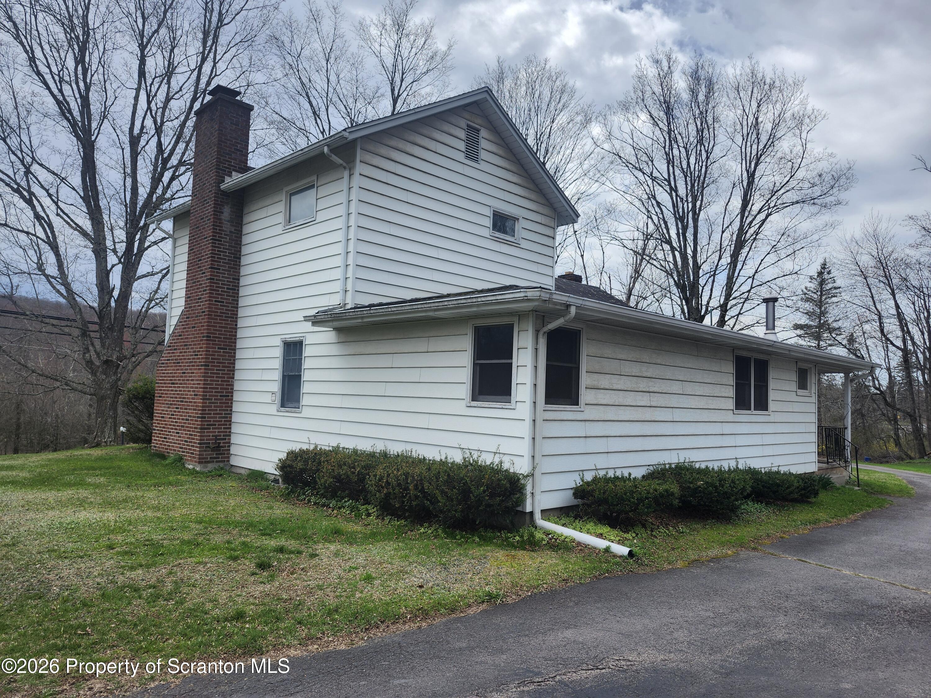 691 Madisonville Road Moscow, PA 18444 - Photo 25 of 31 a view of a house with a yard