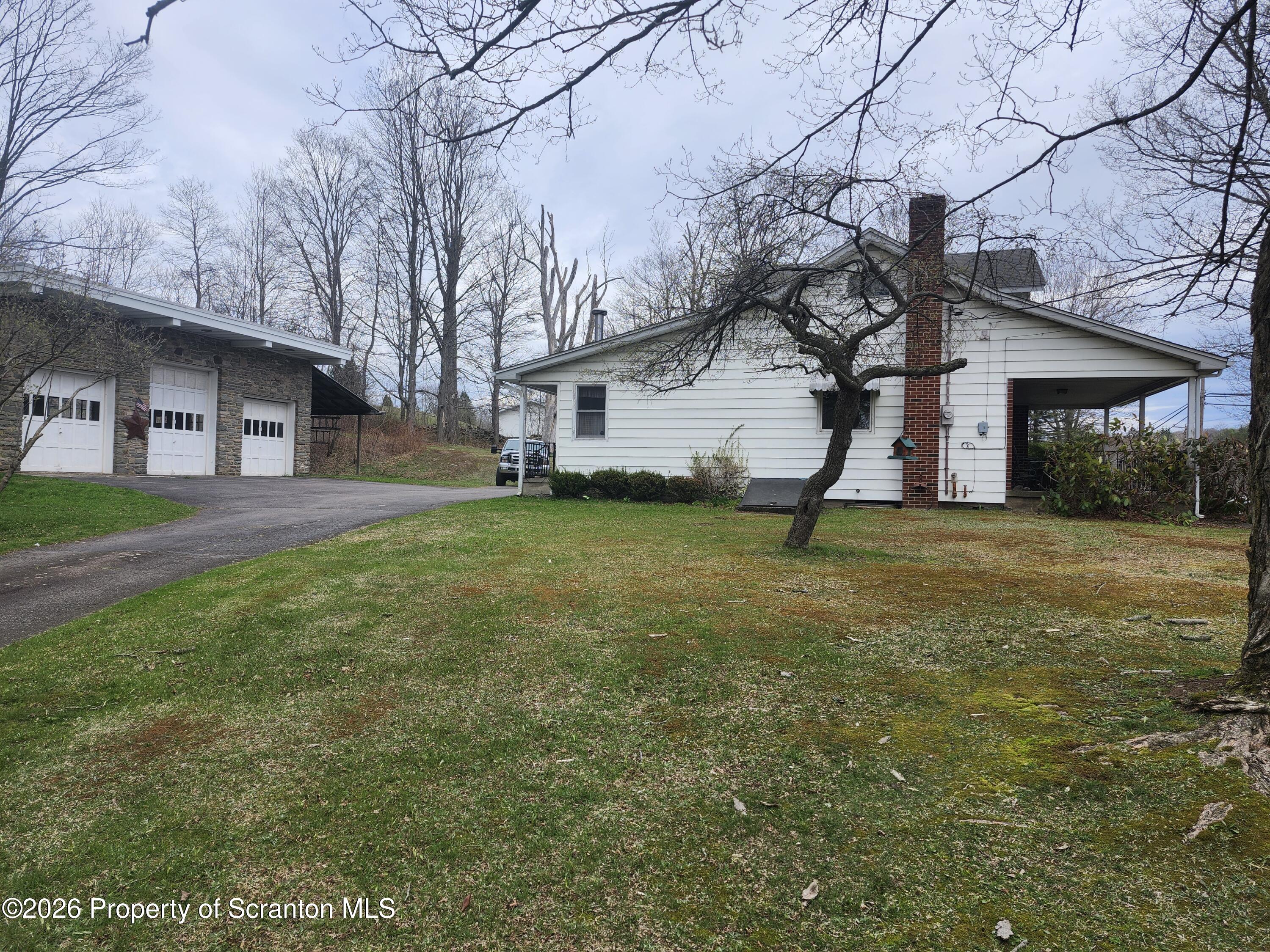 691 Madisonville Road Moscow, PA 18444 - Photo 26 of 31 a house view with a garden space