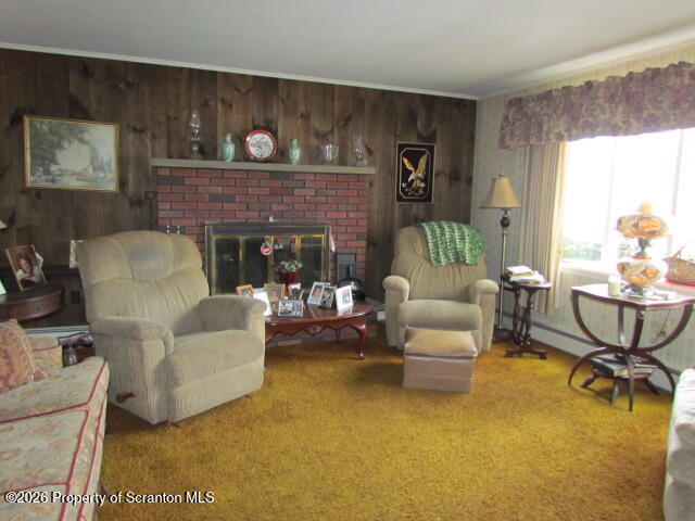 691 Madisonville Road Moscow, PA 18444 - Photo 3 of 33 a living room with furniture and a fireplace