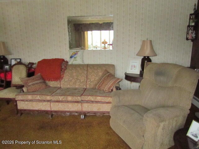 691 Madisonville Road Moscow, PA 18444 - Photo 6 of 33 a living room with furniture and a wooden floor