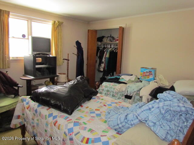 691 Madisonville Road Moscow, PA 18444 - Photo 10 of 33 a bedroom with two bed and a flat tv screen