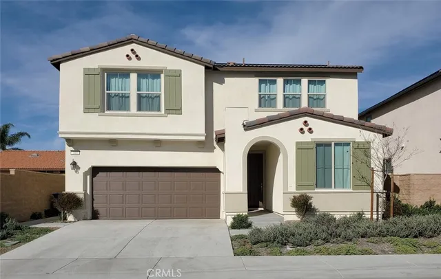 a front view of a house with garage