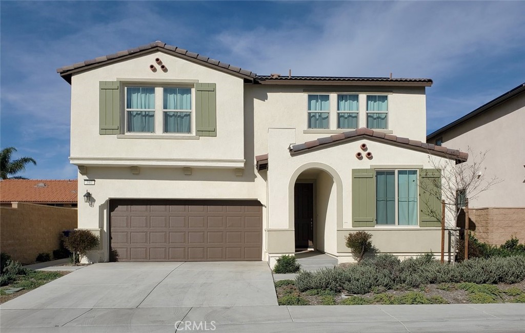 a front view of a house with garage