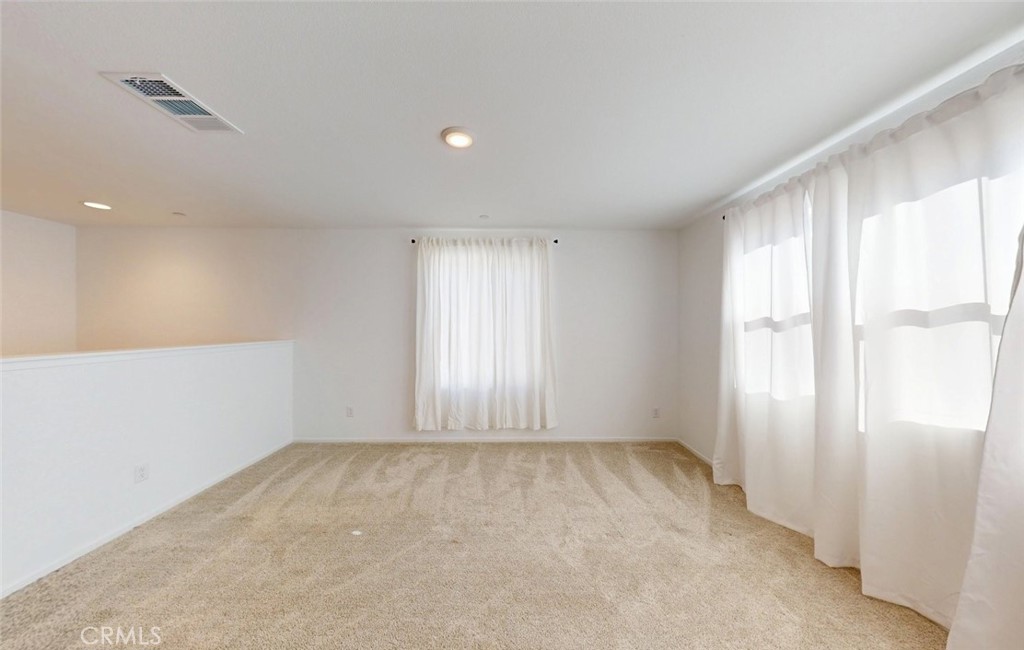 340 Lilly Rialto, CA 92376 - Photo 25 of 50 wooden floor in an empty room with a window