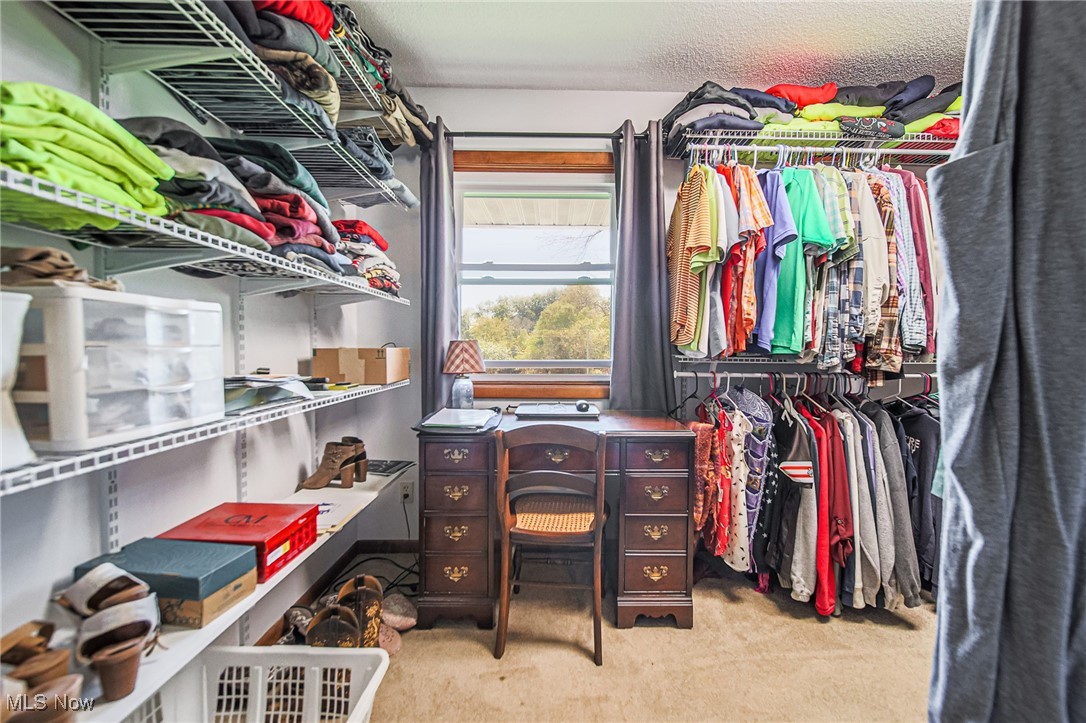 1791 Beal Road Mansfield, OH 44903 - Photo 24 of 50 Spacious closet off primary bedroom featuring light colored carpet