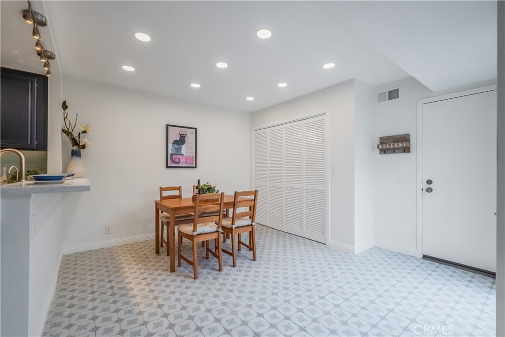 19 Dartmouth Irvine, CA 92612 - Photo 15 of 44 a dining room with furniture and a chandelier