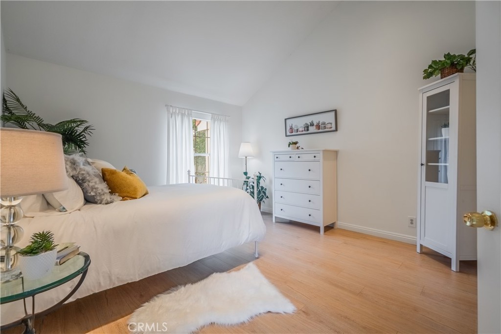 19 Dartmouth Irvine, CA 92612 - Photo 17 of 44 a bedroom with a bed and cabinets