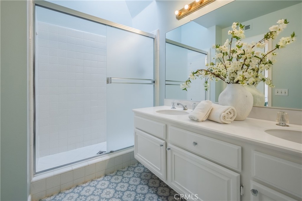 19 Dartmouth Irvine, CA 92612 - Photo 20 of 44 a bathroom with a sink and mirror