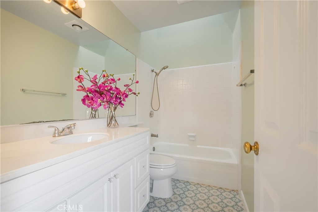 19 Dartmouth Irvine, CA 92612 - Photo 22 of 44 a bathroom with a sink mirror toilet and bathtub